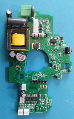 Top view of a motor controller PCB with capacitors, a transformer, resistors, and integrated circuits mounted.