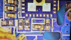 PCB with Removed T34 Chip Close-up of a PCB with the T34 chip removed.