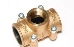 Brass clamp with a threaded hole and screws.