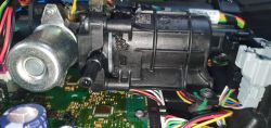Close-up of AdBlue pump with visible leakage and car electronics.