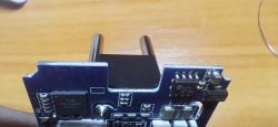 Close-up of a smart plug module with T34 chip and electronic components on PCB
