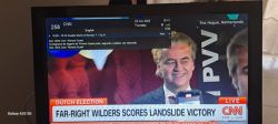 Television showing CNN channel with Dutch election coverage.