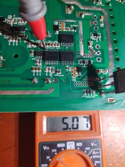 Measuring voltage on a circuit board using a multimeter