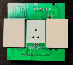 Electronic board labeled WIFI W6B with visible traces and connectors.