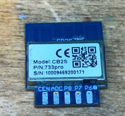Image of a Tuya CB2S BK7231N module on a wooden surface.