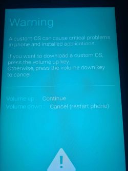Ekran tabletu z ostrzeżeniem o instalacji niestandardowego systemu operacyjnego.