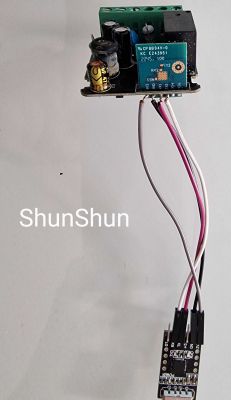 Mini Smart Switch with UART Connection Mini Smart Switch board with wires connected to a UART controller.