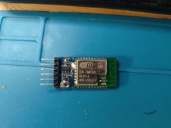 DX-WF24A Wi-Fi/BLE Module on Breakout Board DX-WF24A module with BK7238 chip on a breakout board, placed on a blue service mat.