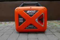 AIVOLT SC2300i-0 Inverter Generator Orange AIVOLT SC2300i-0 inverter generator on a cobblestone pavement.