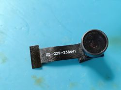 X5-G29-2364V1 Camera Module on FFC Cable Camera module with X5-G29-2364V1 printed on a black FFC cable lying on a blue surface.