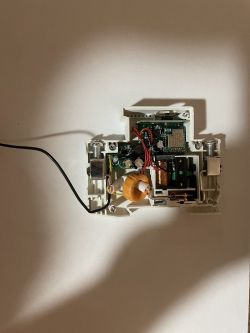 Dismantled EARU RDCBC2-WIFI power meter with visible electronic components