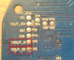 Photo of the back side of a PCB with reversed silkscreen text.