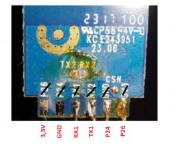 Close-up of a circuit board with pins labeled 3.3V, GND, RX1, TX1, P24, P26.
