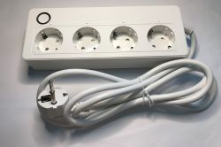 White power strip with four Schuko sockets and a coiled power plug