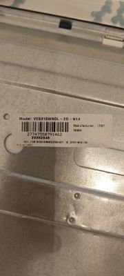 Model label VES315WNDL-2D-N14 on metal surface Label with model VES315WNDL-2D-N14 on a metallic panel