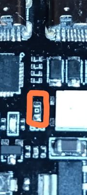 Electronic component on a PCB marked with orange frame