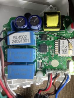 Interior view of a 3-phase energy meter with visible electronic components.