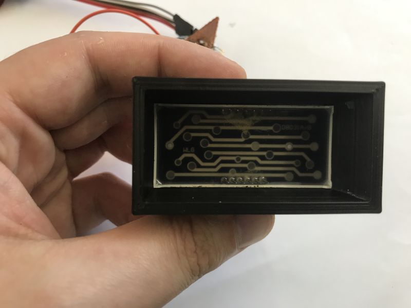 Prototype board with PIC18F2550 microcontroller, 7-segment display, and a potentiometer used for ADC testing.