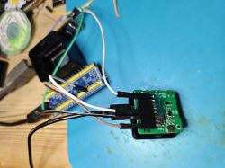 TXWDevCube module wired to a development board on a blue mat