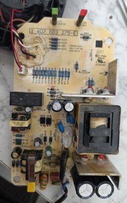 Bosch GAL 1880CV Charger Circuit Board Close-up of a circuit board with electronic components and two LED lights.