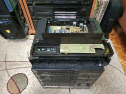 Disassembled radio module on top of a Schneider Hi-Fi tower with visible PCB
