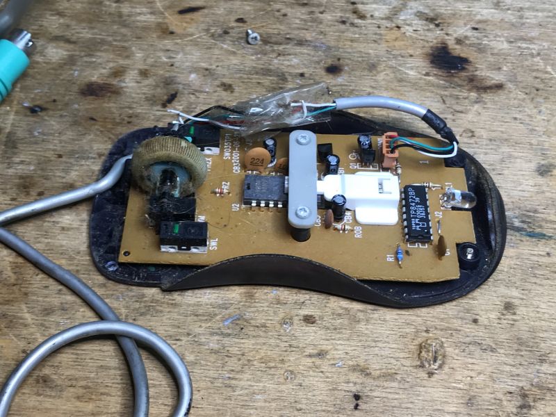 Interior of an Old Computer Mouse Interior of an old computer mouse with visible electronic components.