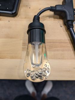 Jasco Enbrighten Cafe Light with Visible Wiring Jasco Enbrighten Cafe light with cable on wooden table