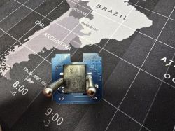 Close-up of the WF09 plug PCB with two pins and bottom-only soldering