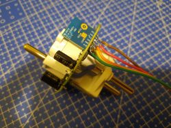 Dismantling of IMMAX NEO LITE 07762L Smart Plug Dismantled IMMAX NEO LITE 07762L smart plug with attached wires.