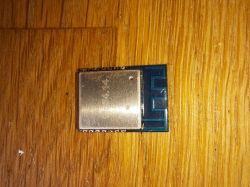 LMA35 electronic module with a metal casing on a wooden surface.