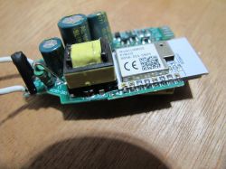 Electronic circuit board with components, including capacitors and transformer.