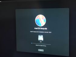 macOS Sequoia Installation on SSD macOS Sequoia installation screen on SSD with time progress.