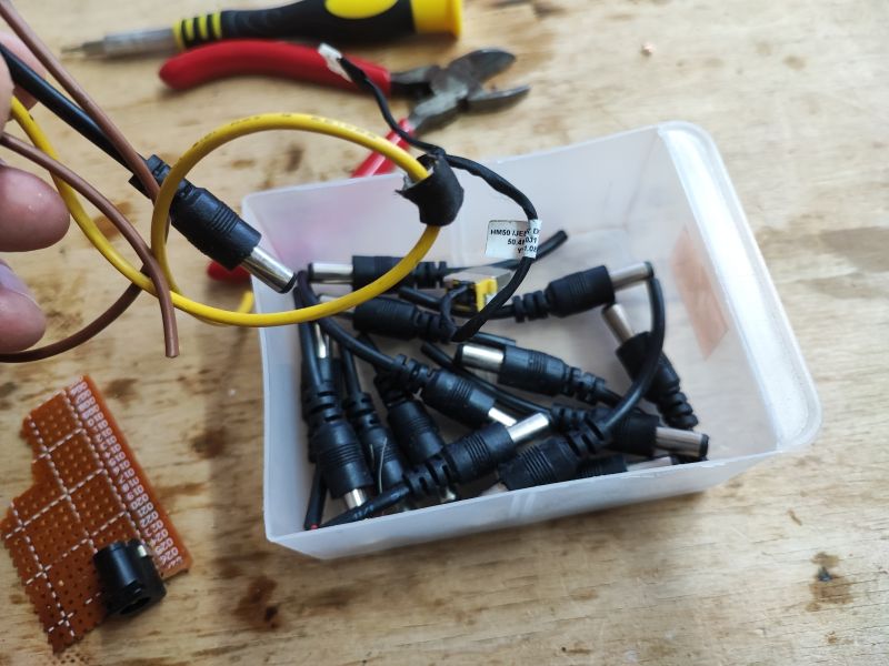 DC Power Connectors in Workshop Box of DC power connectors on a workshop table.