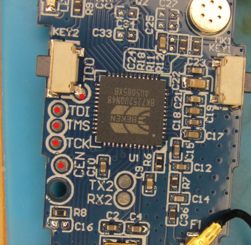 PCB with BEKEN BK7252UON48 chip and debug interface Close-up of a PCB with BEKEN BK7252UON48 chip and labeled debug pins