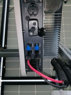 Close-up of a SOFAR inverter with cables connected to PV1 and unused PV2 ports.