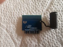 Electronic module with spiral antenna on paper towel background