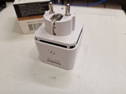 Camelion Smart Home smart plug with two prongs and a button on the front.