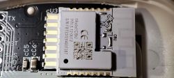 Close-up of an electronic module Model CBU on a PCB, showing pins and markings.