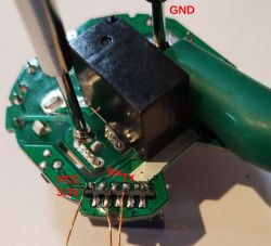 PCB with Labeled Soldering Points Close-up of a PCB with labels VCC, RX, TX, and GND