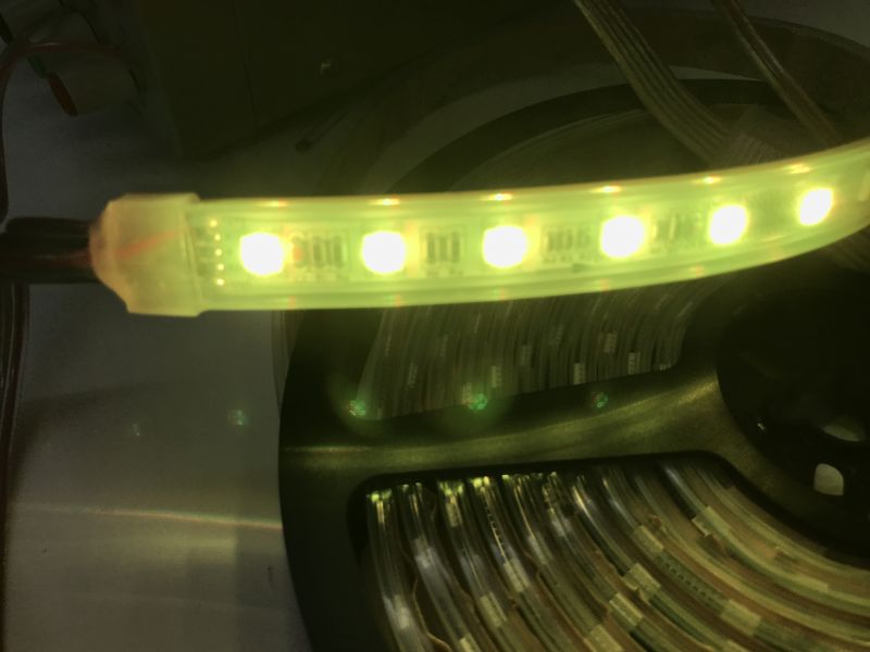 RGBW LED Strip with TM512 Chip and DMX512 Protocol Five-meter RGBW LED strip with 60 SMD5050 LEDs per meter and labeled power and communication lines.