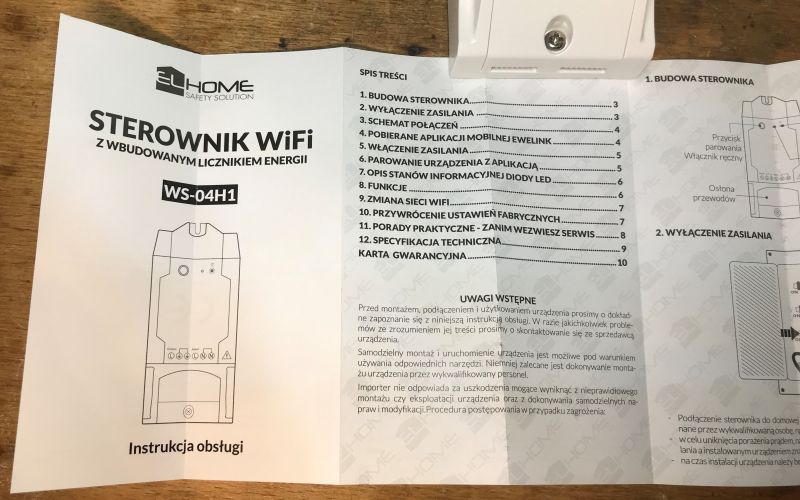 User Manual for WS-04H1 WiFi Controller User manual for the WS-04H1 WiFi controller with the elHome logo lying on a wooden table.