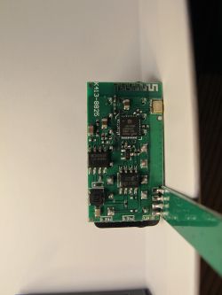 Close-up of an electronic module with markings K413-8825 and integrated circuit components.