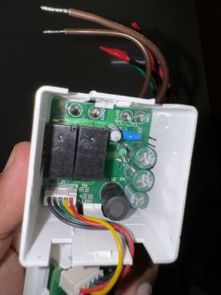 Interior of 2 Gang Tuya Switch Close-up of the inside of a 2 Gang Tuya switch with visible electronic components.