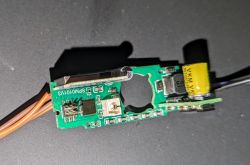 View of a disassembled circuit board with electronic components.
