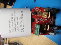 Internal view of a WiFi smart plug with visible casing and PCB.