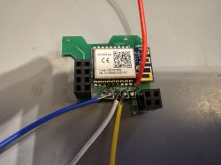 ESP8266 WiFi module with connected wires on a prototype PCB