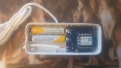 Interior of a Water Leak Detector with Batteries Open interior of a water leak detector featuring batteries and a circuit board.