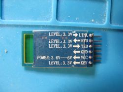 HC-05 Bluetooth Module with Pinout Labels HC-05 Bluetooth electronic module with labeled pins on a blue PCB.