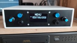 Internet Radio Prototype with OLED Display Prototype of an internet radio with an OLED display on a desk.