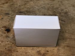 White Box on a Table White box on a wooden background.